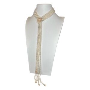 Multi-strand white cultured pearl lariat necklace with silver spacer beads,